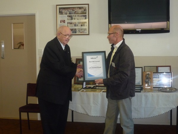 Bert McConnell receiving his BikeNZ Road & Track Life Membership Certificate from Garry Bell, BRT President
